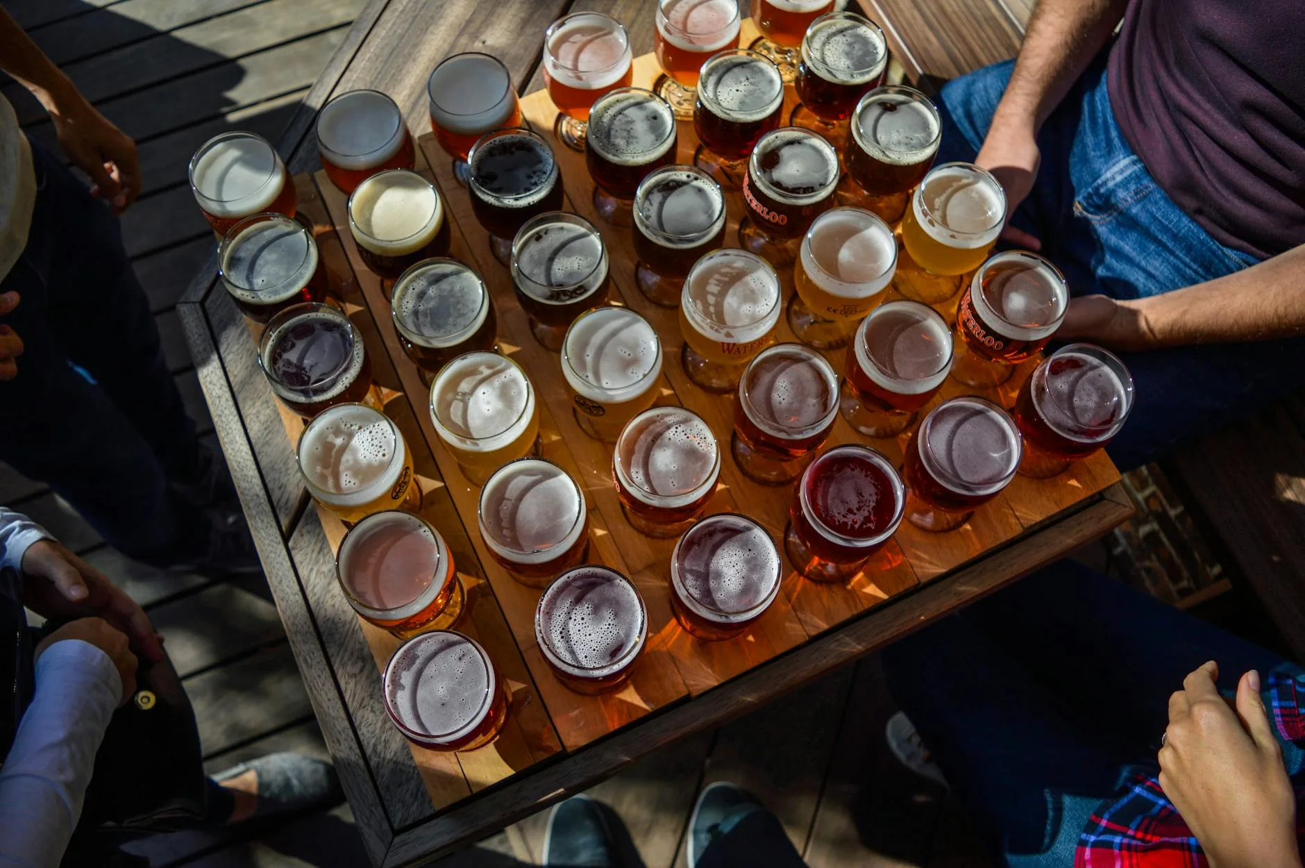 Selection of different beer styles in tasting glasses from light to dark