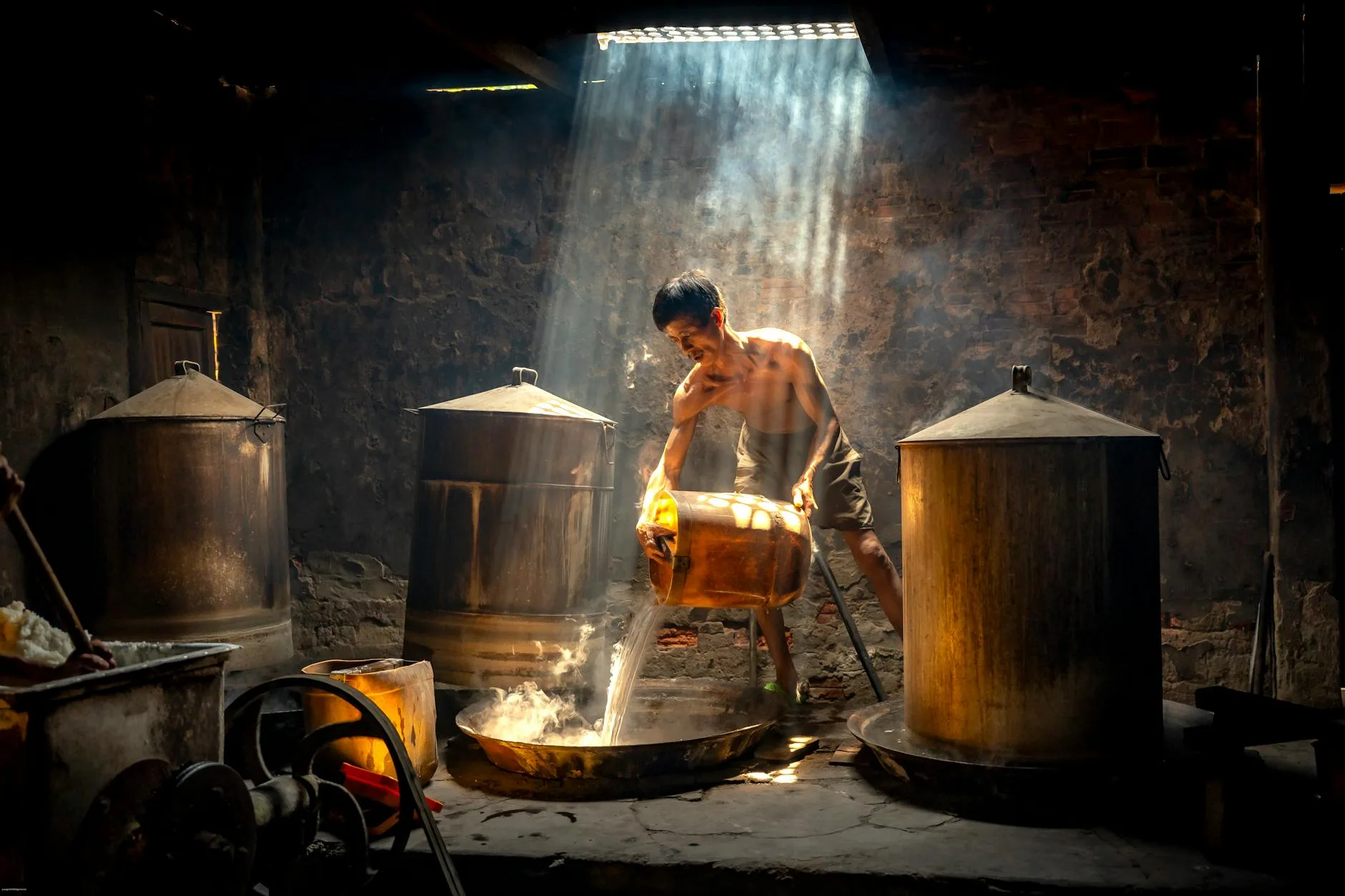Pouring wort during the homebrew fermentation process