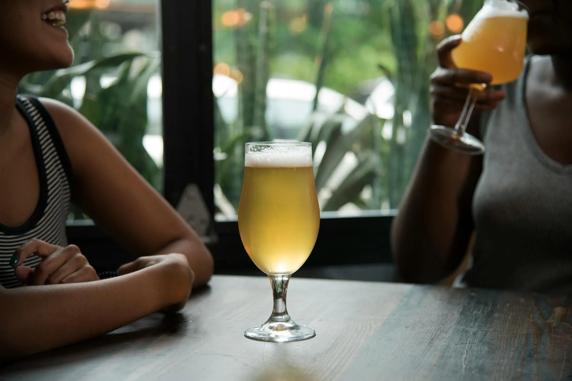 Brewing ingredients including grain hops and malt on a table