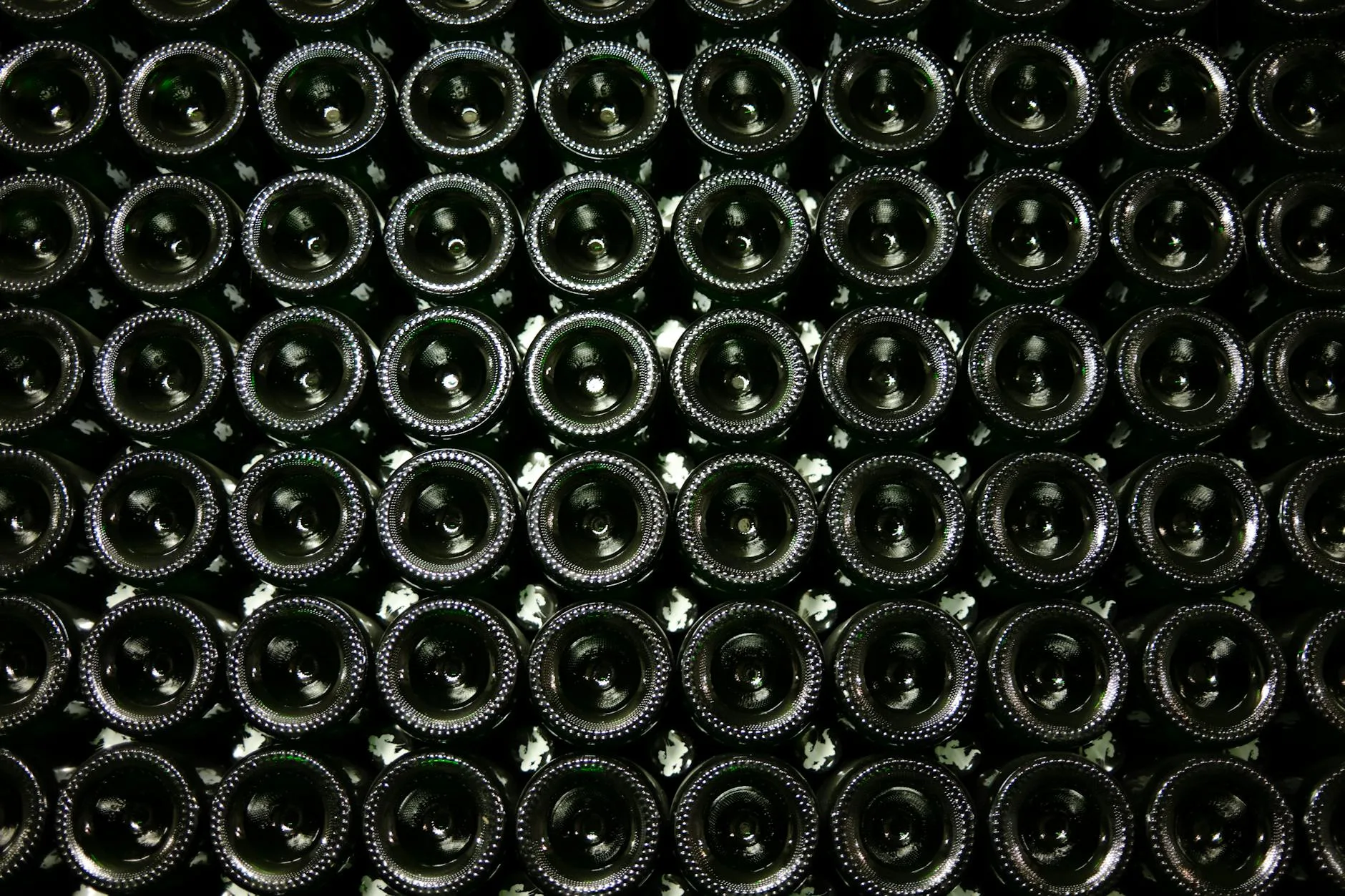 Wine bottles stacked horizontally during aging