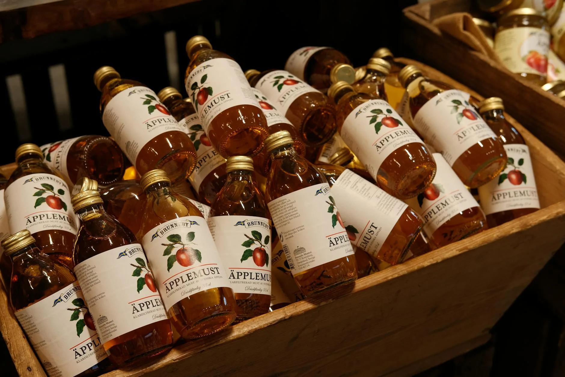 Glass of golden homemade cider with amber colour
