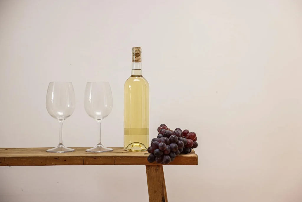 Glass demijohn with airlock during wine fermentation at home