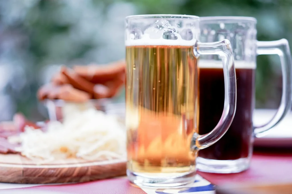 Glass of amber craft beer with rich golden colour