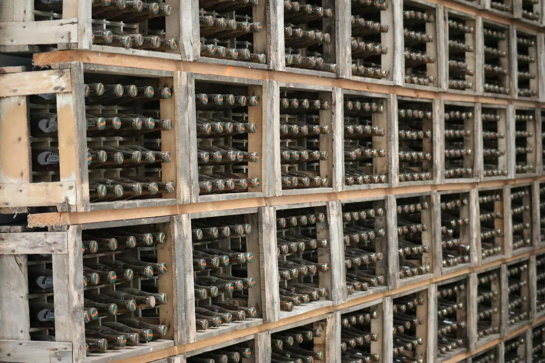 Craft beer bottles arranged in a wooden crate