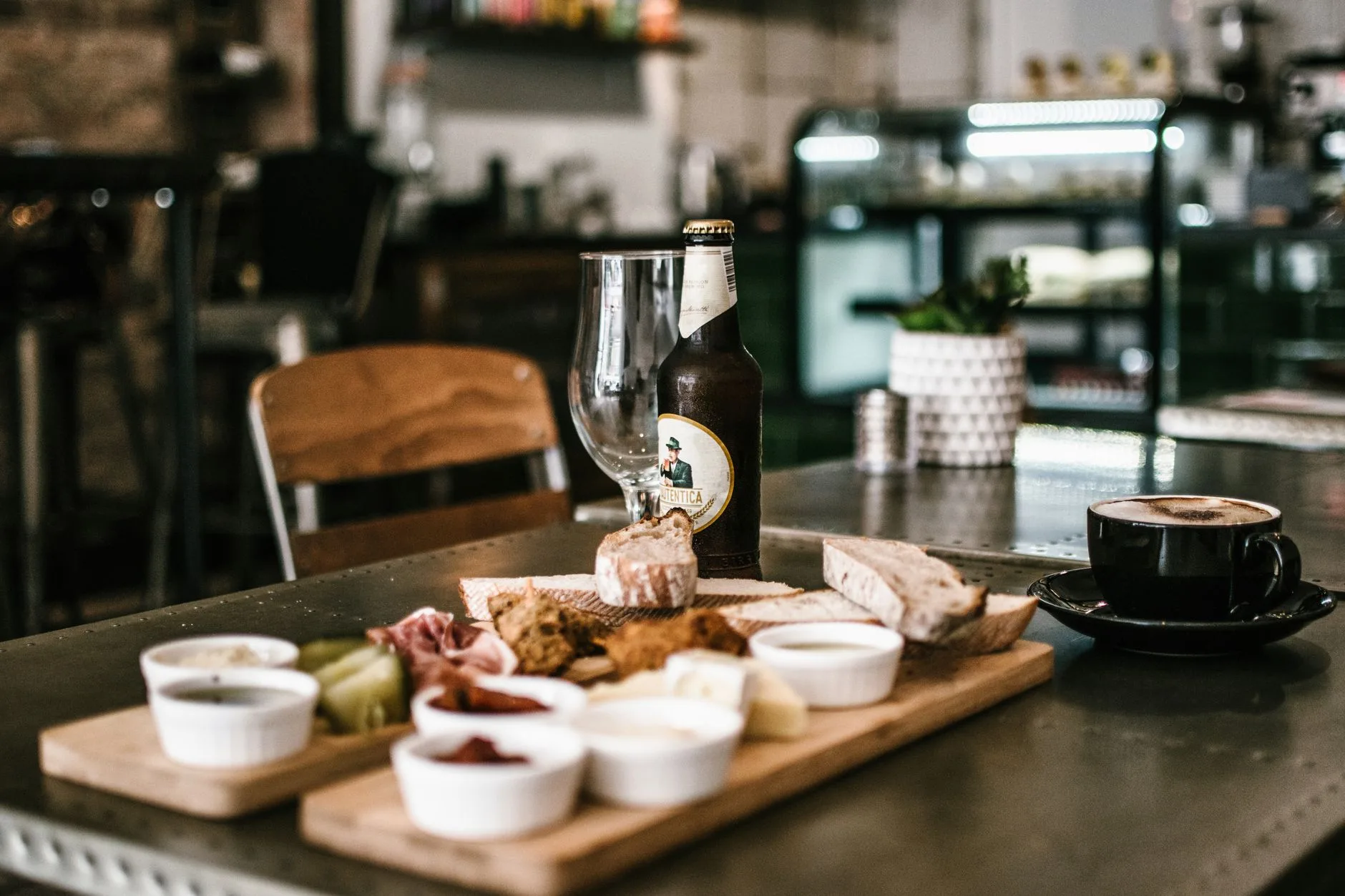 Craft beer bottles and simple snacks on a tasting table