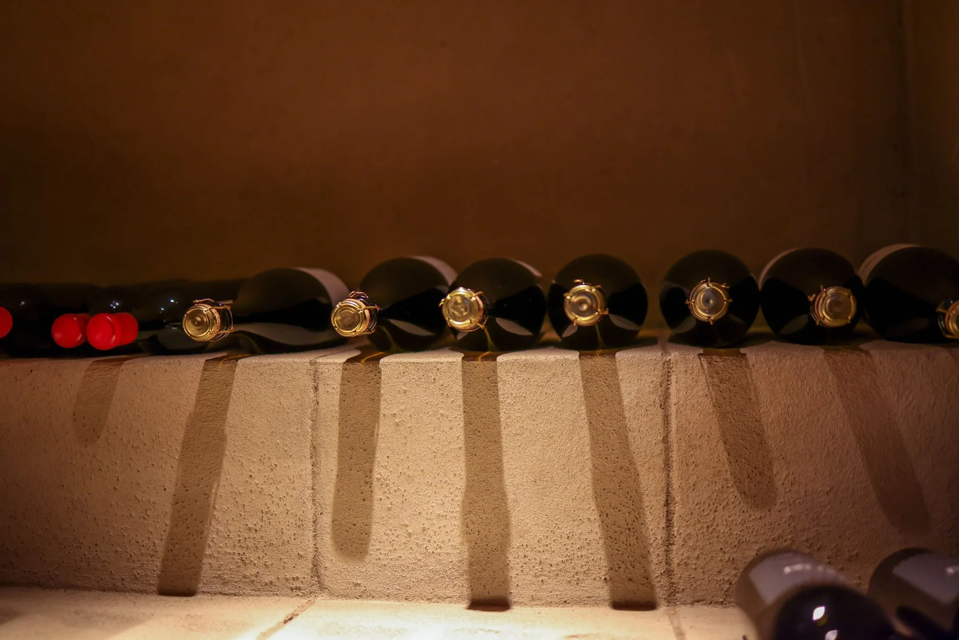 Wine bottles stored with corks showing oxidation prevention context